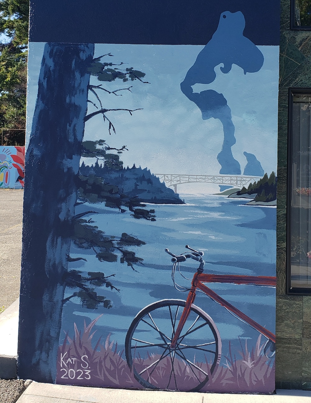 Outdoor mural of a bike and scenery